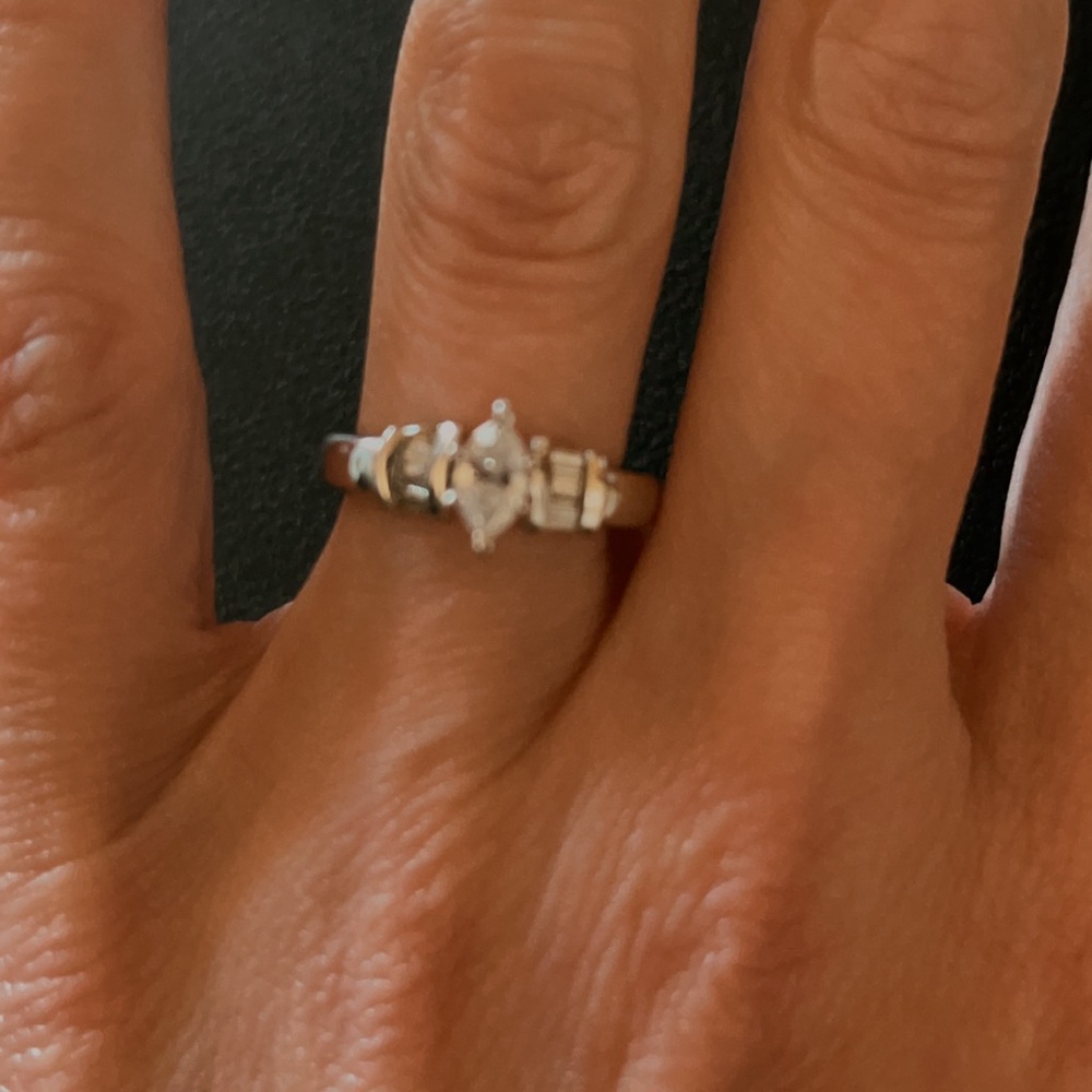 Real Diamond ring set in platinum. Size 4-5 ring finger.